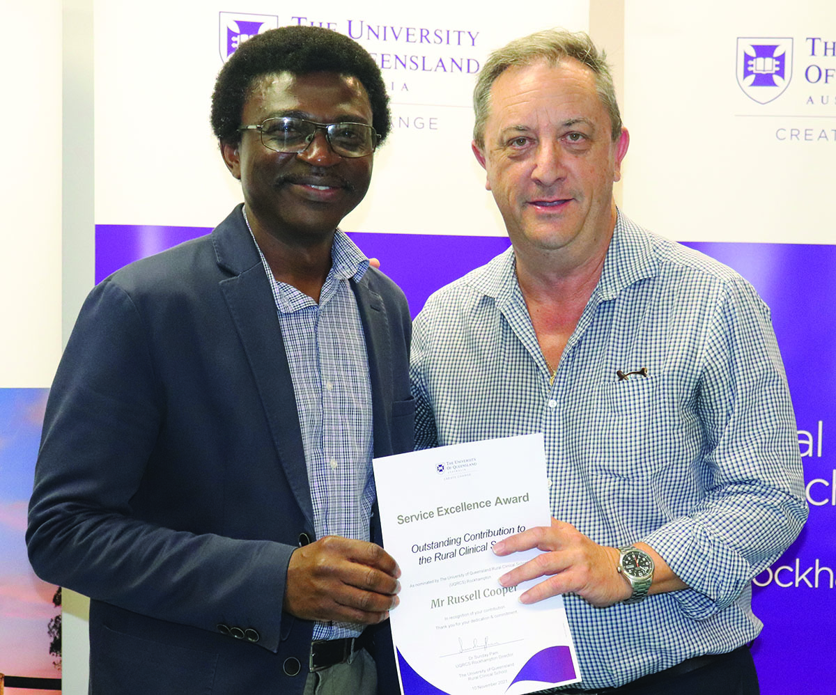 Mr Russell Cooper (right) receiving the Outstanding Contribution to the Rural Clinical School honours from Associate Professor Sunday Pam at the Rockhampton Regional Clinical Unit Teaching Awards.